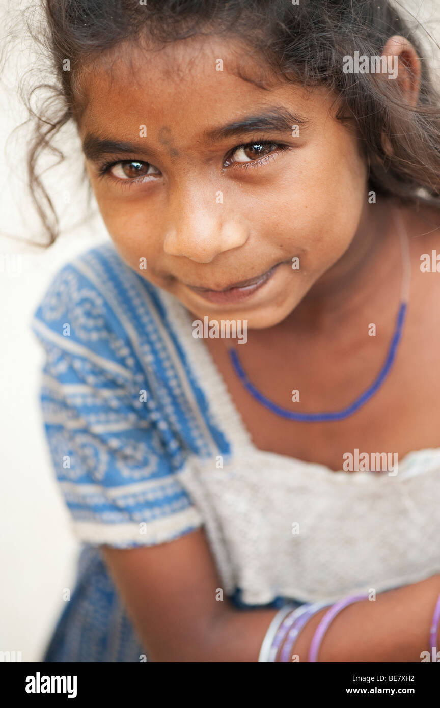 Pretty lower caste indian beggar girl looking up. Andhra Pradesh, India. Selective focus Stock Photo