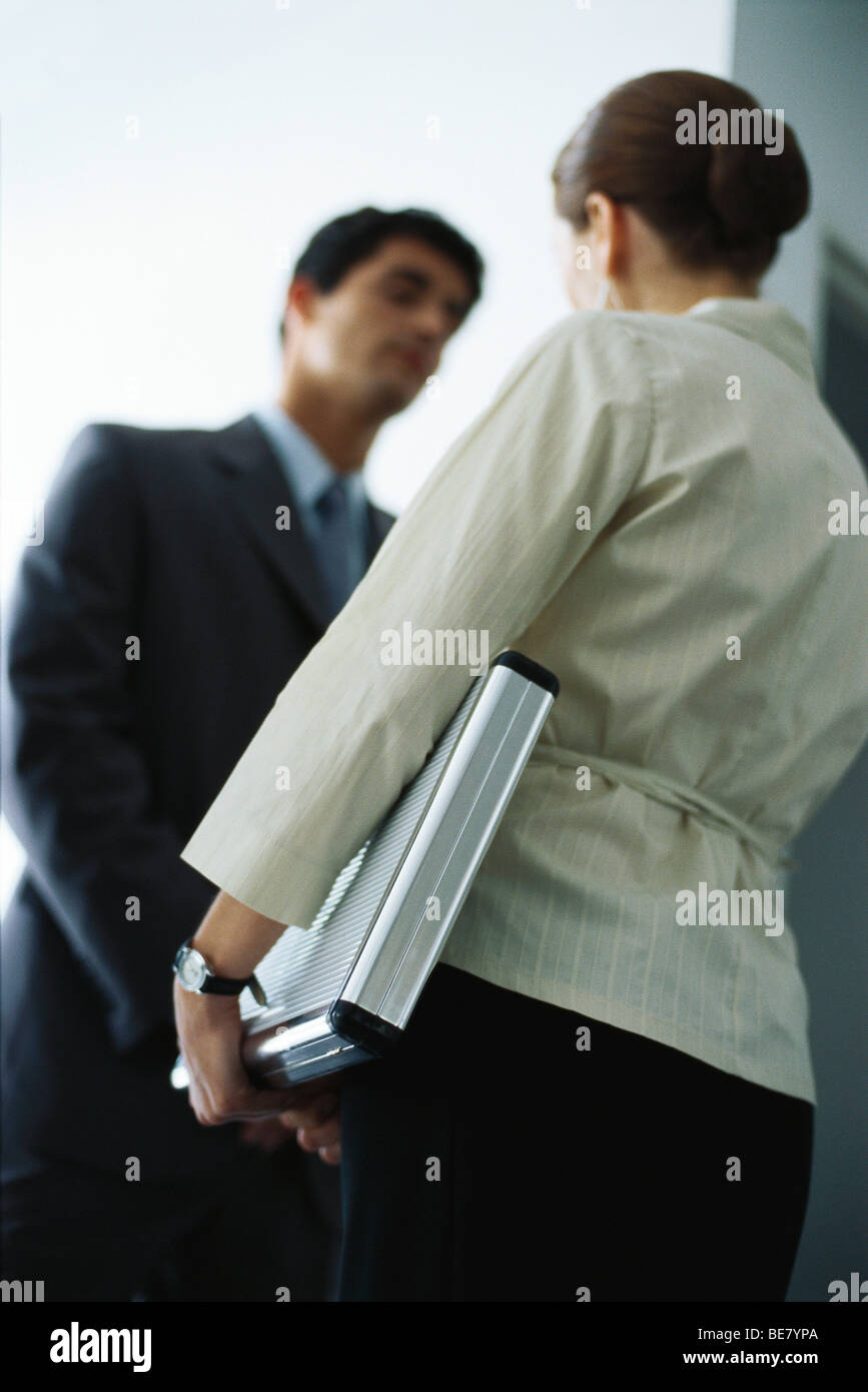 Businesswoman in conversation with colleague, low angle view Stock Photo