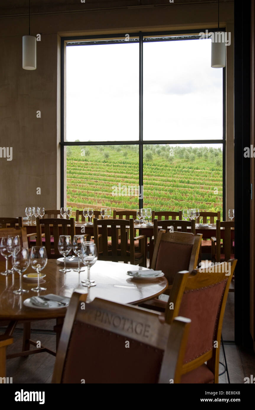 Tables are laid at the restaurant Stellenbosch with view at vineyard