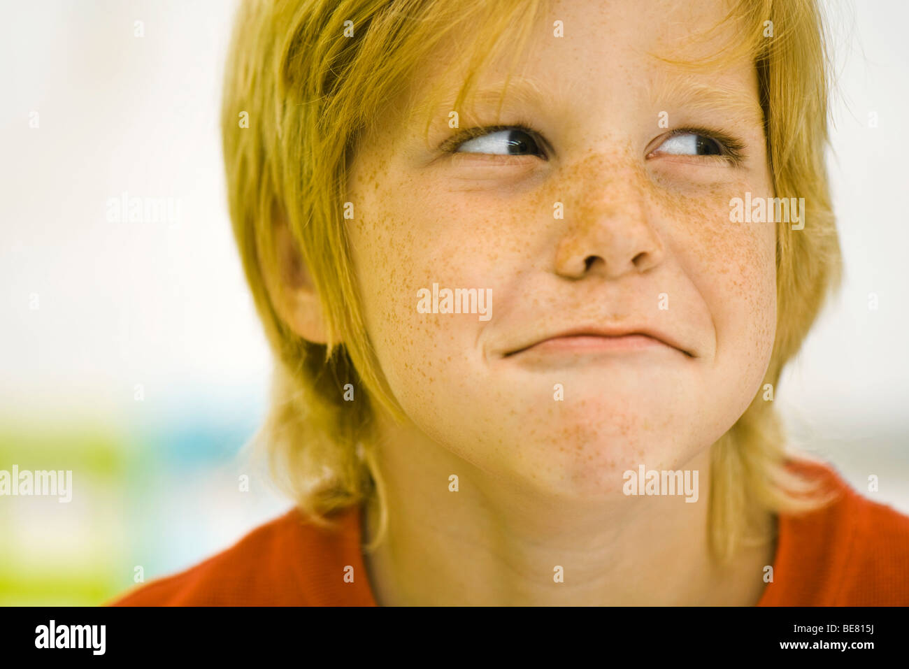 Little boy frowning Stock Photo