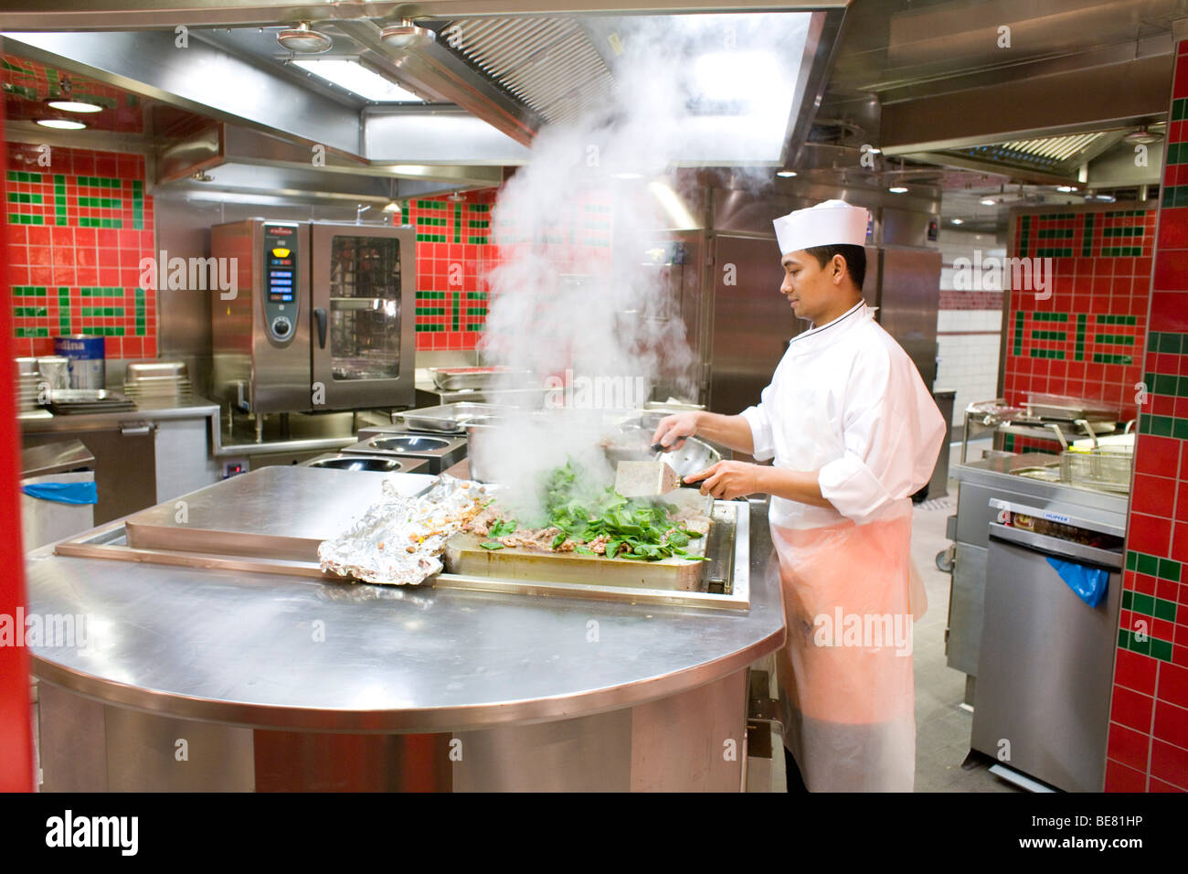 A cook working in the kitchen of cruise ship AidaDiva Stock Photo