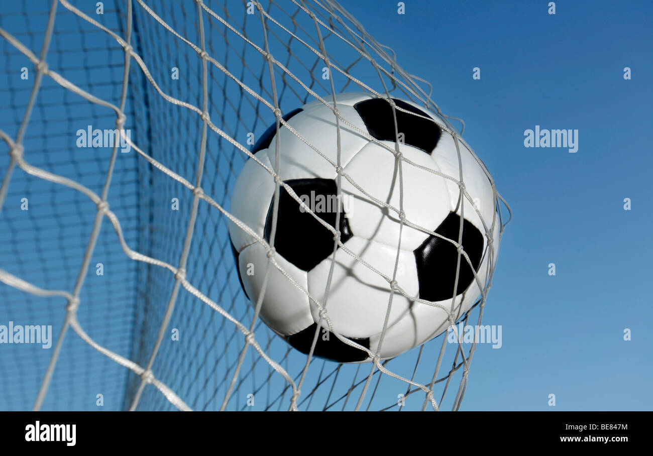 Soccer ball kicked into the back of a goal Stock Photo Alamy