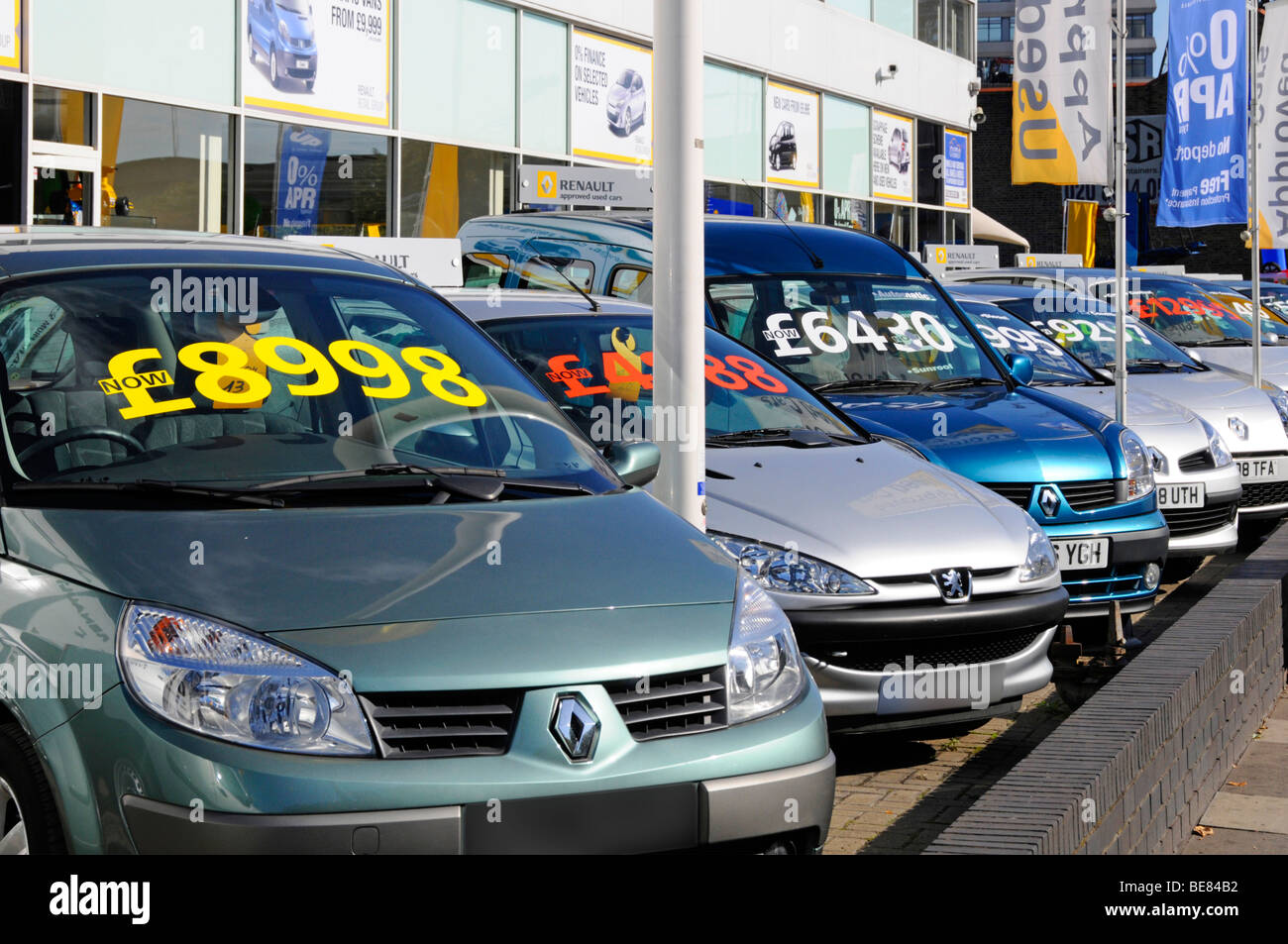 East London Renault car dealer forecourt display of cars with large price labels Stock Photo