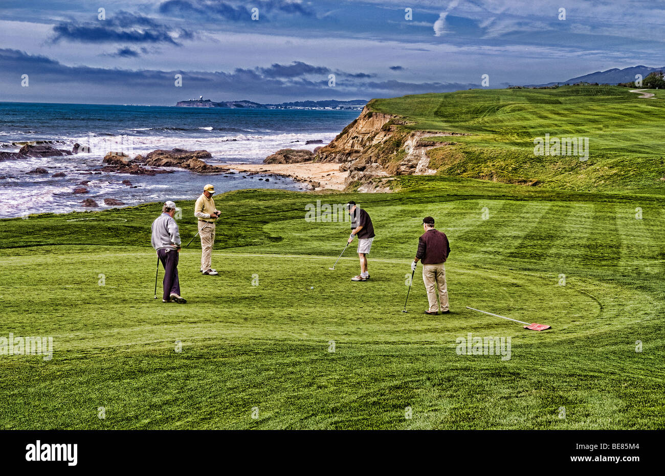 Men friends golfing at 18th green of the famous Old Course at Half Moon