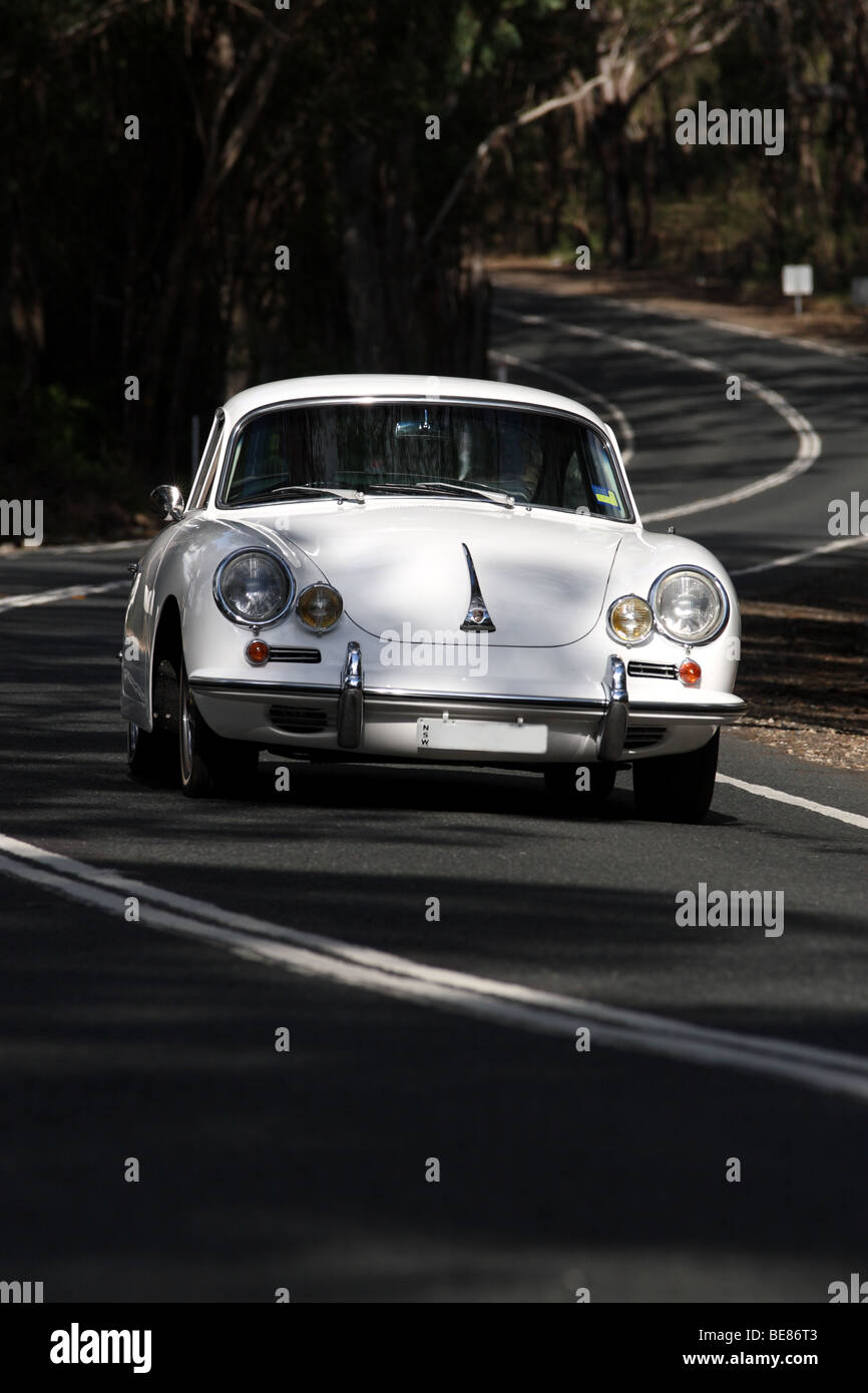 Porsche 356C classic on a winding country road Stock Photo