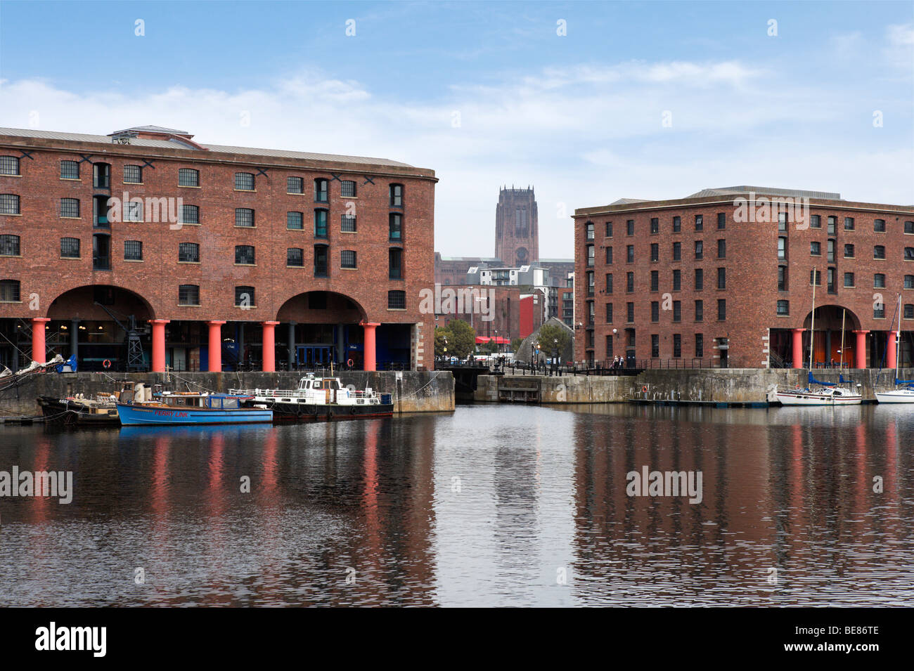 Albert Dock with the Anglican Cathedral in the distance, Liverpool, Merseyside England Stock Photo