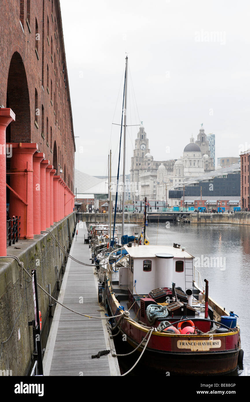 Albert Dock with the Three Graces in the distance, Liverpool, Merseyside England Stock Photo