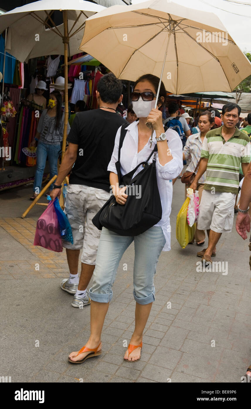 people wearing mask at chatuchak weekend market during pandemic of swine flu,Bangkok,Thailand. Stock Photo