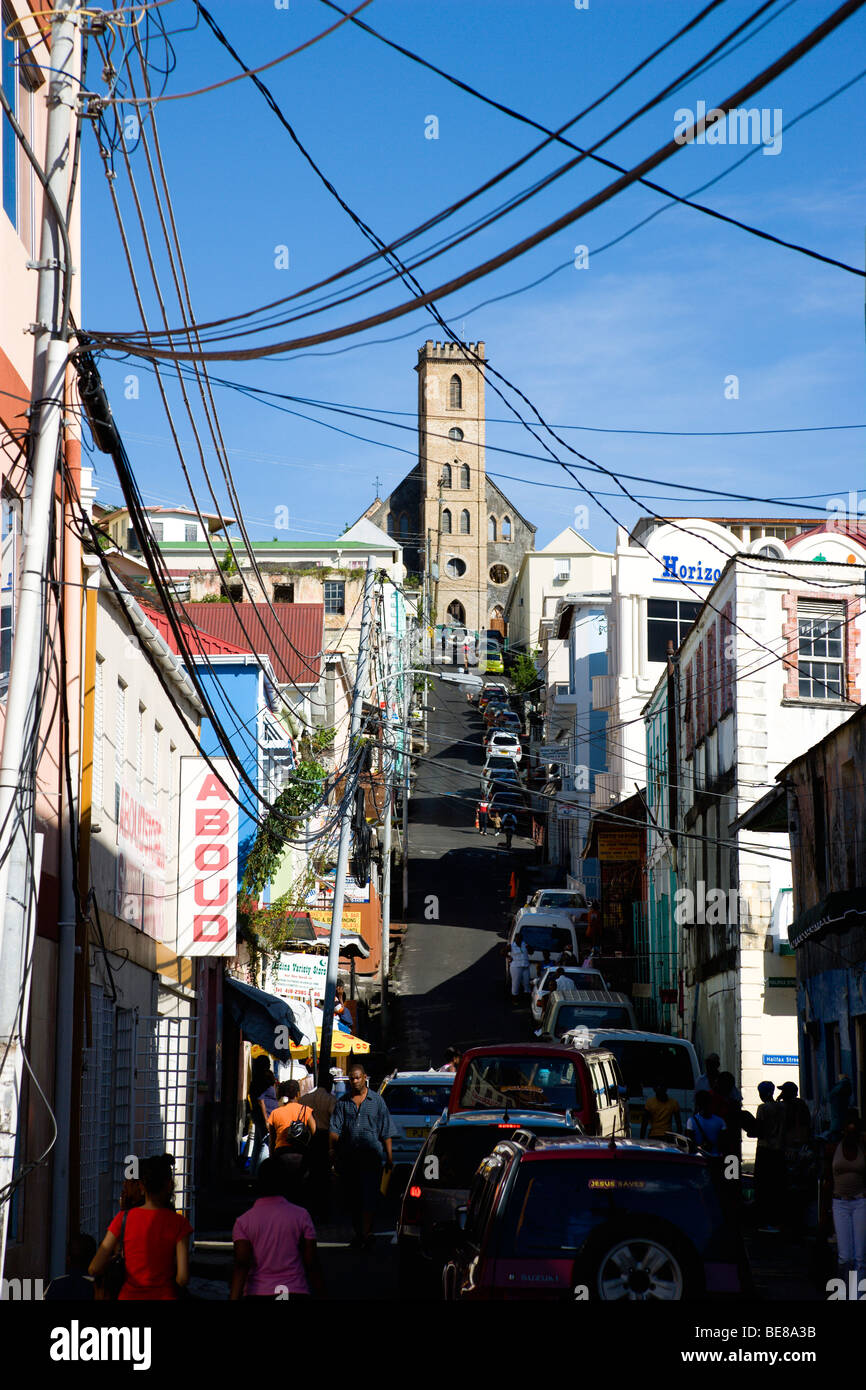 WEST INDIES Caribbean Grenadines Grenada St George's people and cars in St Juille Street leads to hurricane damaged Cathedral Stock Photo