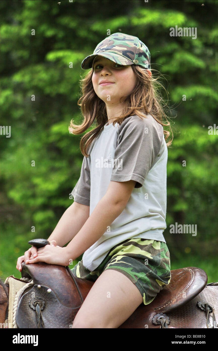 Girl riding horse. Stock Photo