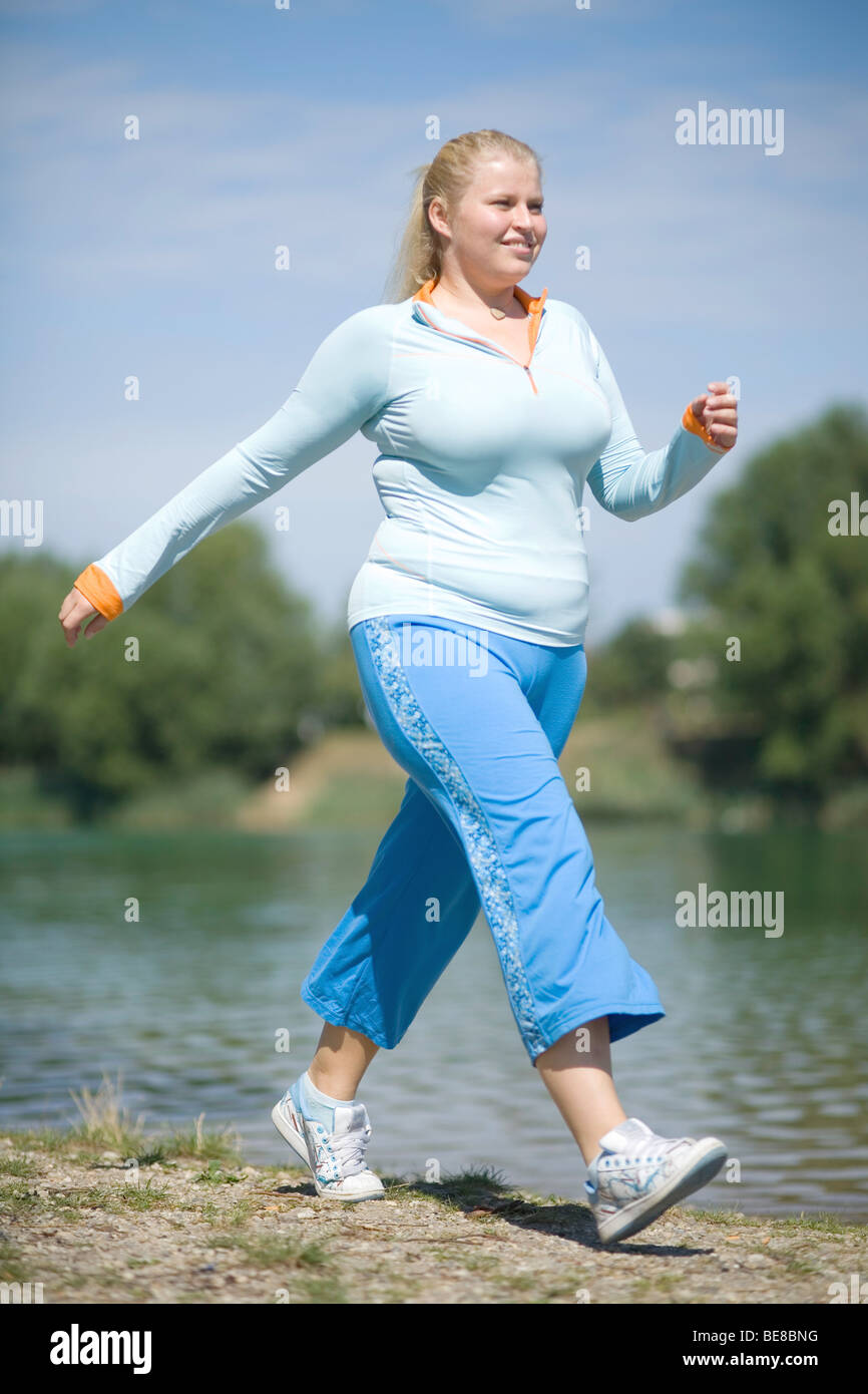 Young fat woman walking Stock Photo - Alamy