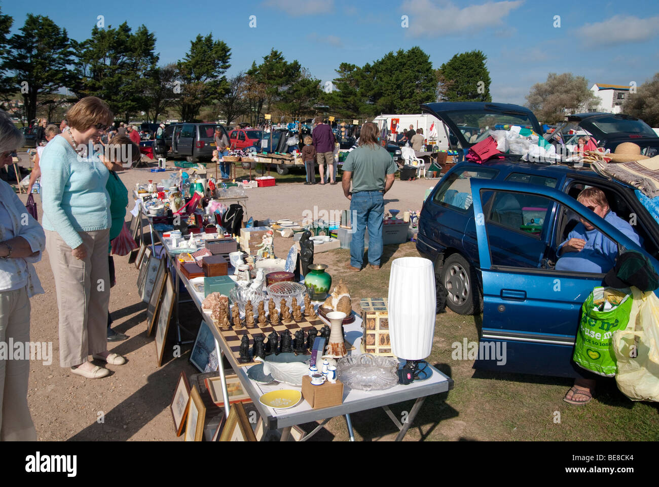 Traders and customers at a Sunday car boot sale in West Bay, Dorset Stock Photo Alamy