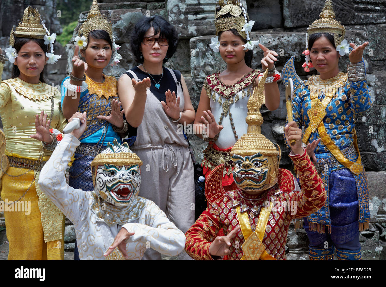 Angkor Wat dancer. Japanese Tourists posing with the local dance troupe at Angkor Wat Siem Reap Cambodia S. E. Asia Stock Photo