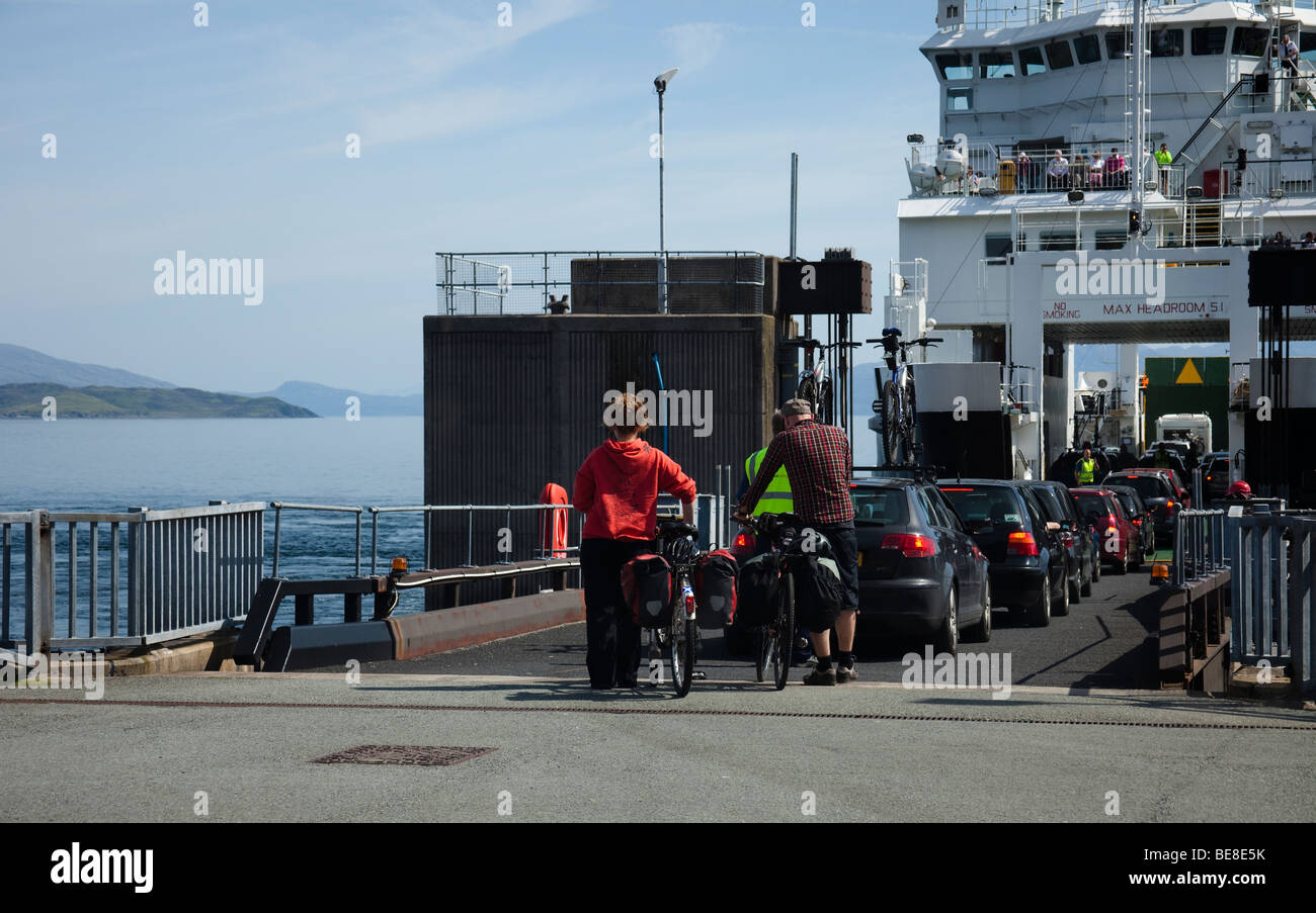 Cyclists and Vehicles boarding Armadale ferry Isle of Skye, Scotland, UK Stock Photo