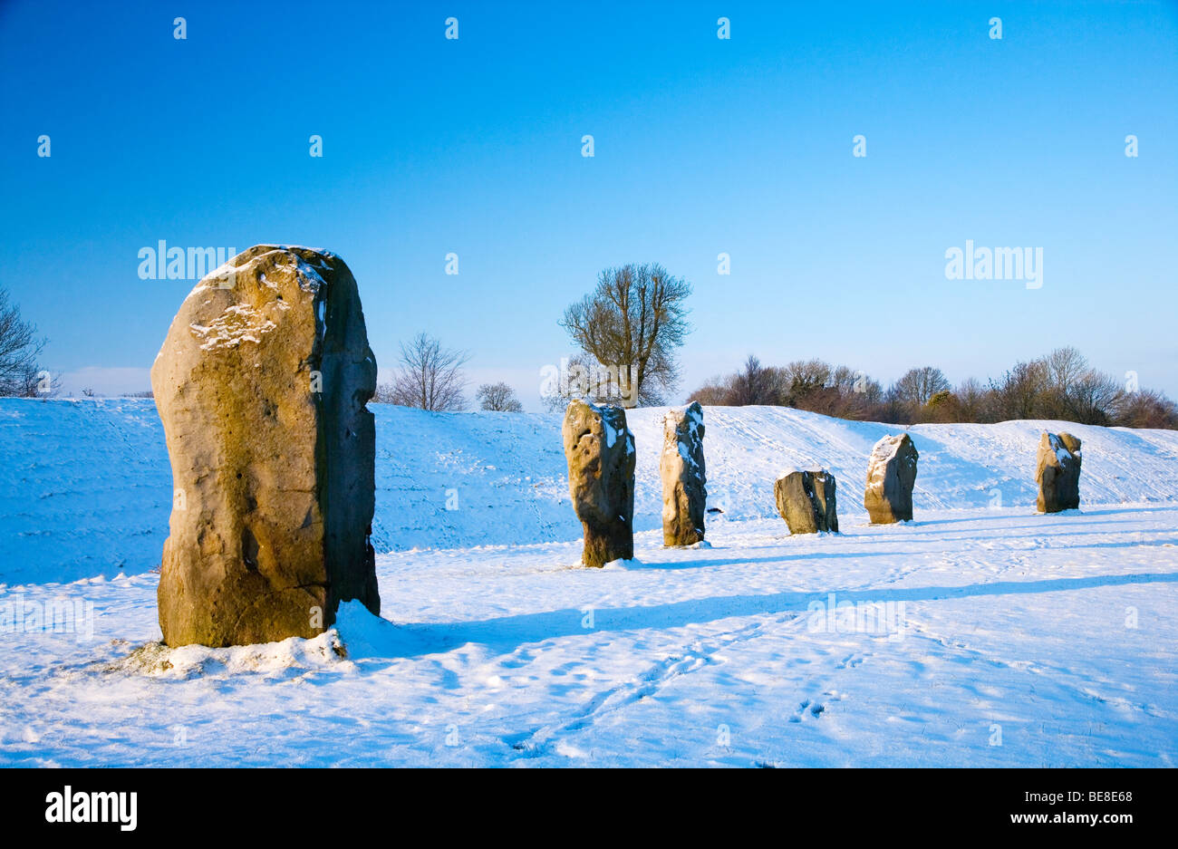 A snowy winter scene at Avebury in Wiltshire, England, UK Stock Photo