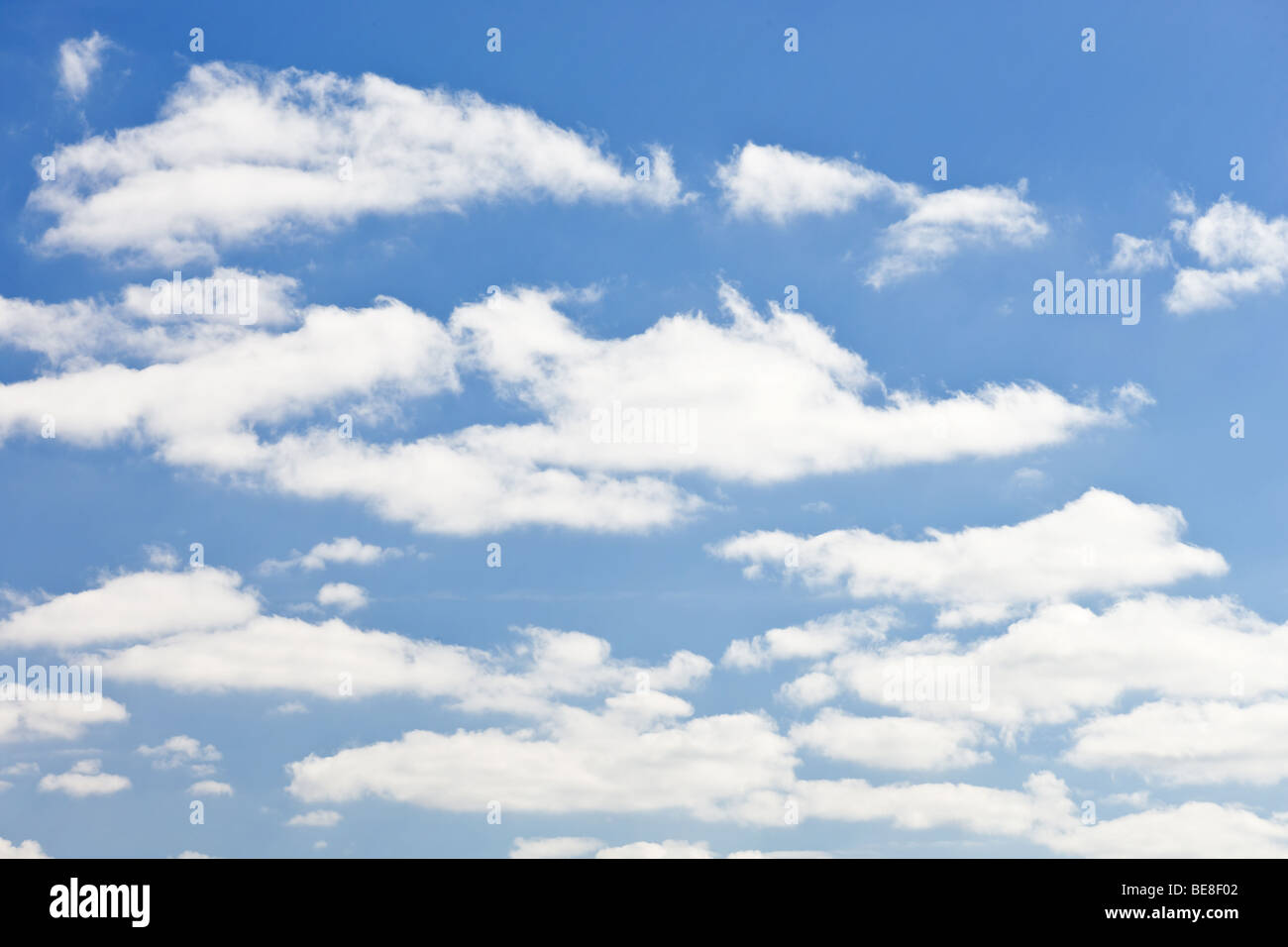 blue sky with white fluffy clouds background Stock Photo - Alamy