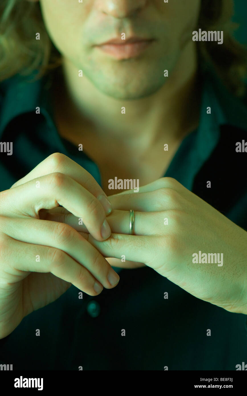 Man preparing to take off wedding ring Stock Photo Alamy