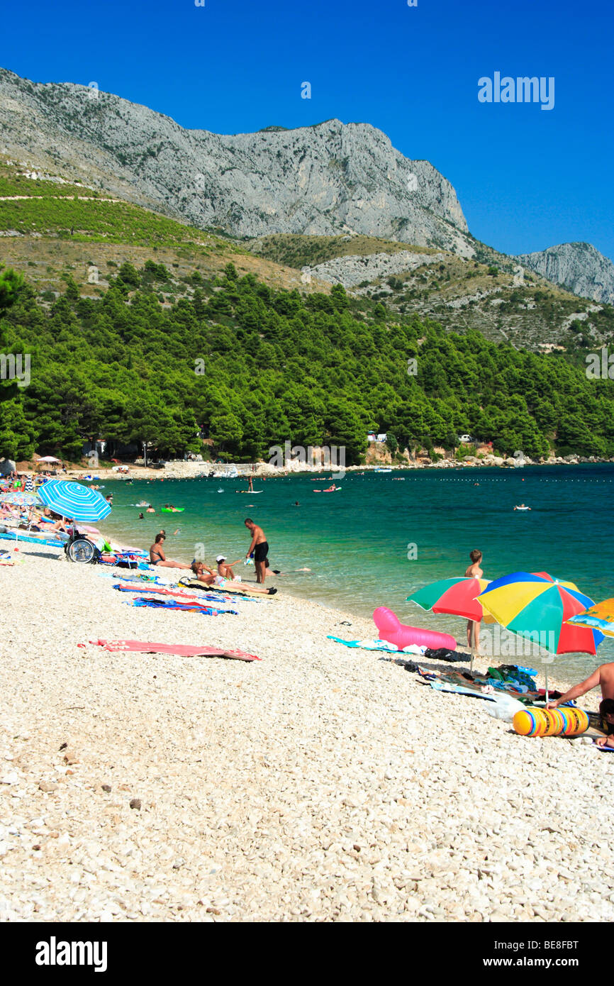 Tourists at a beach in Zivogosce village, Croatia Stock Photo
