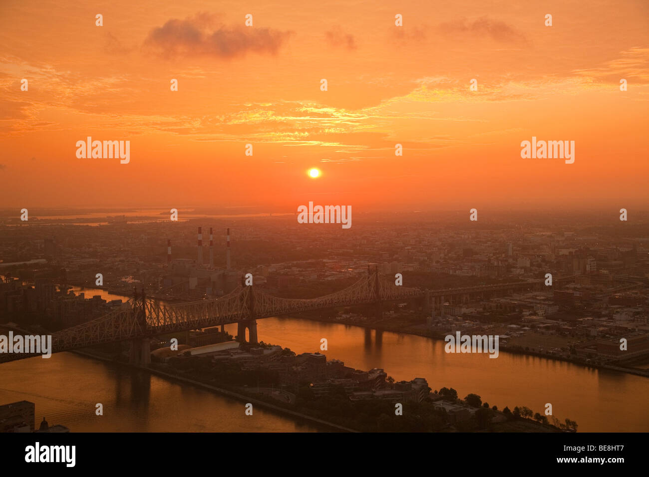 Elevated sunrise view from Manhattan across East River and Roosevelt Island towards Queens. Stock Photo