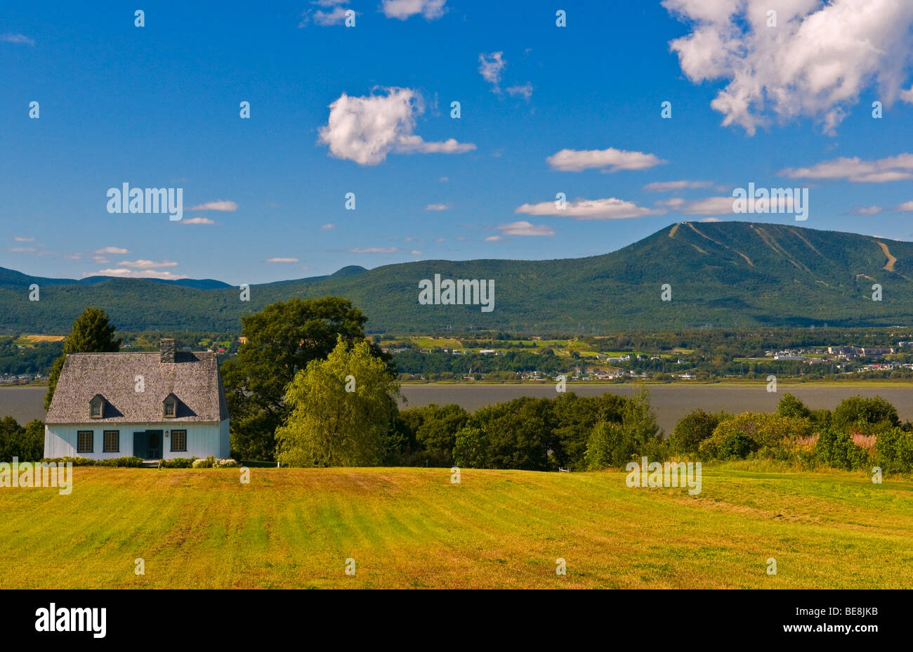 Countryside in Sainte Famille Island of Orleans with a view of Mont Sainte Anne in the Background Quebec Canada Stock Photo