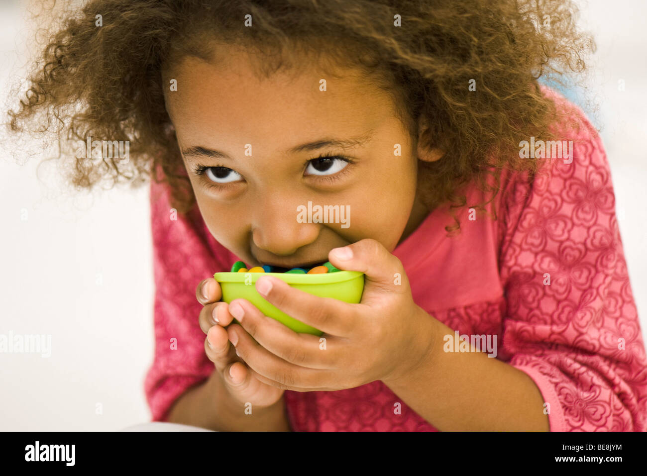 Girl eating candy Stock Photo Alamy