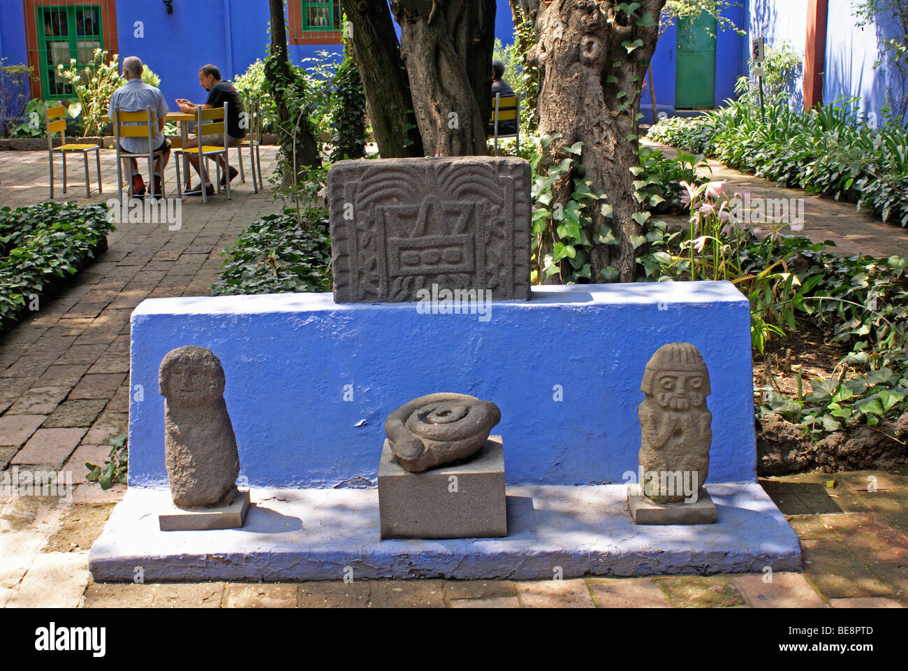 Pre-Columbian artifacts and outdoor cafe , Museo Frida Kahlo, also known as the Casa Azul, or Blue house, Coyoacan, Mexico City Stock Photo