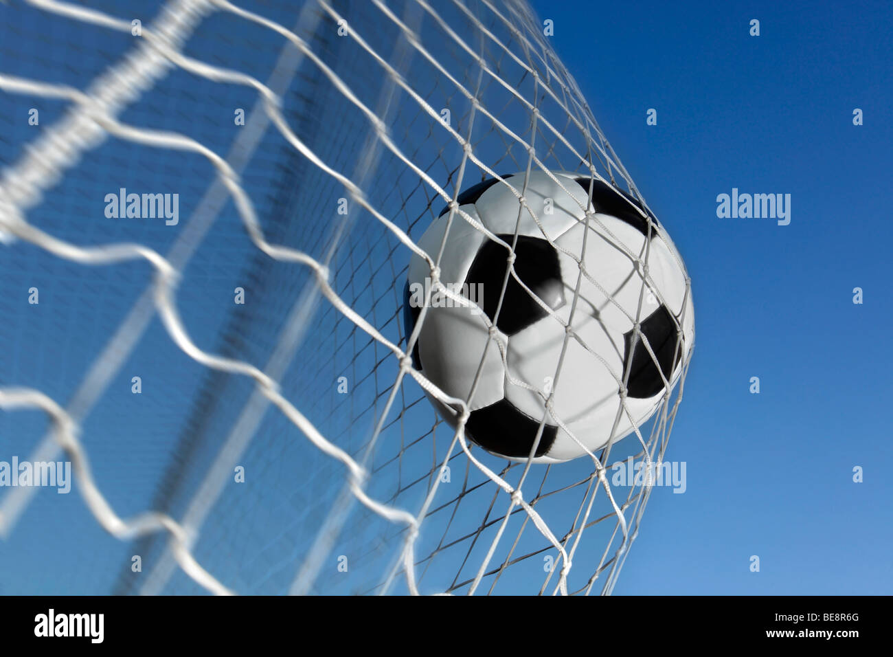 Soccer Ball Kicked Into The Back Of A Goal Stock Photo Alamy