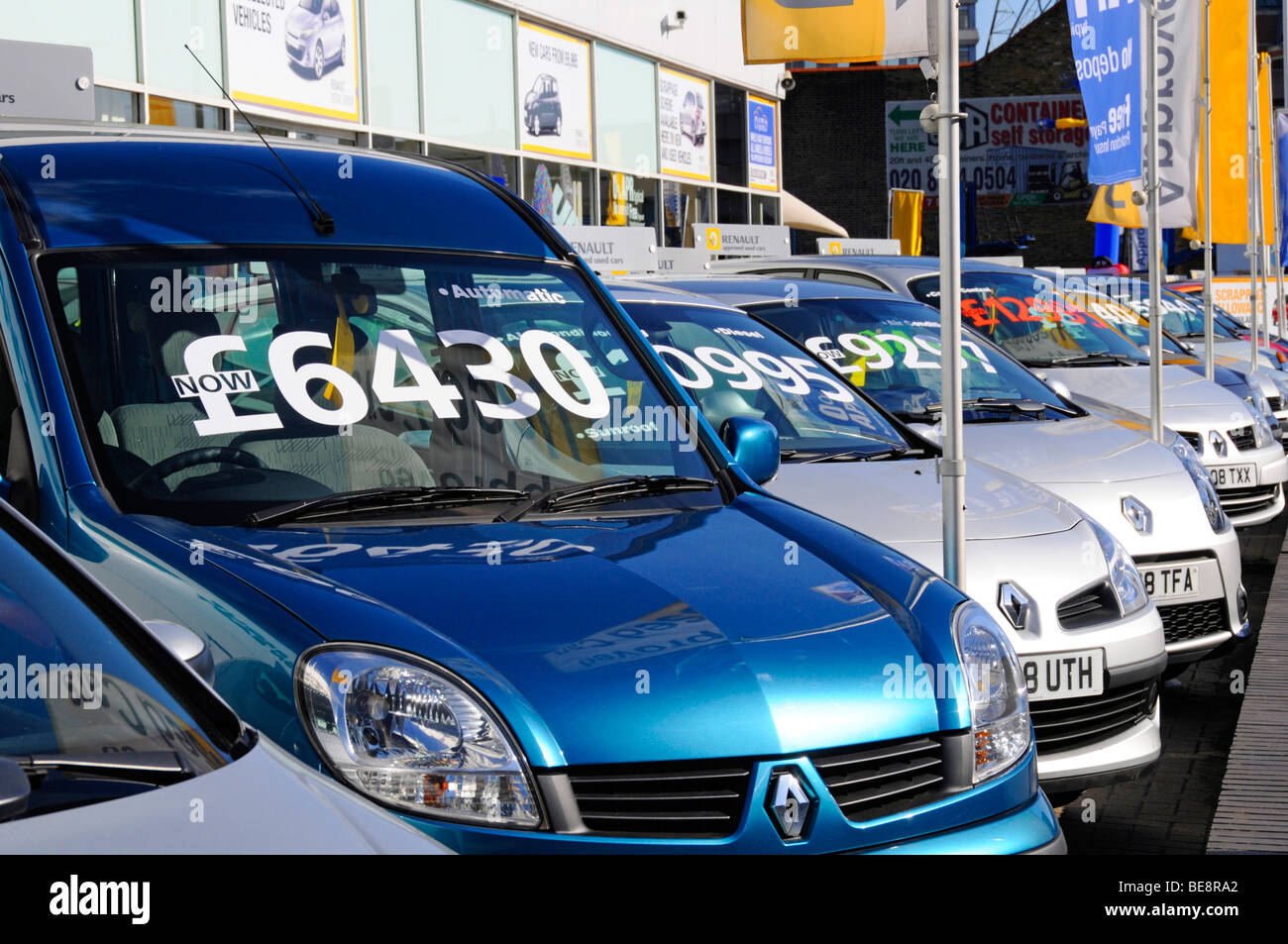 East London Renault car dealer forecourt display of cars with large price labels Stock Photo
