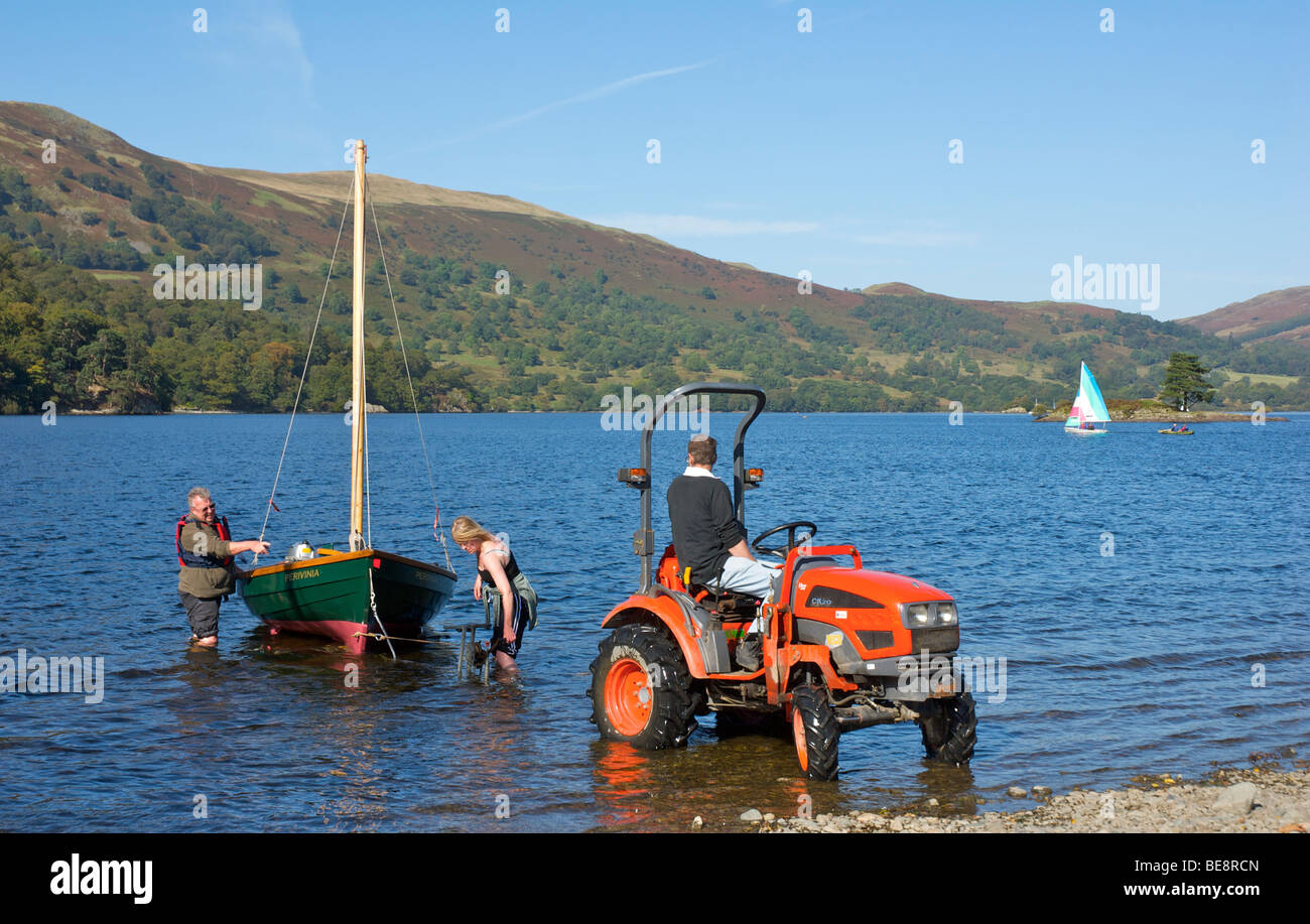 Putting sailing boat on trailer, Ullswater, Lake District National Park