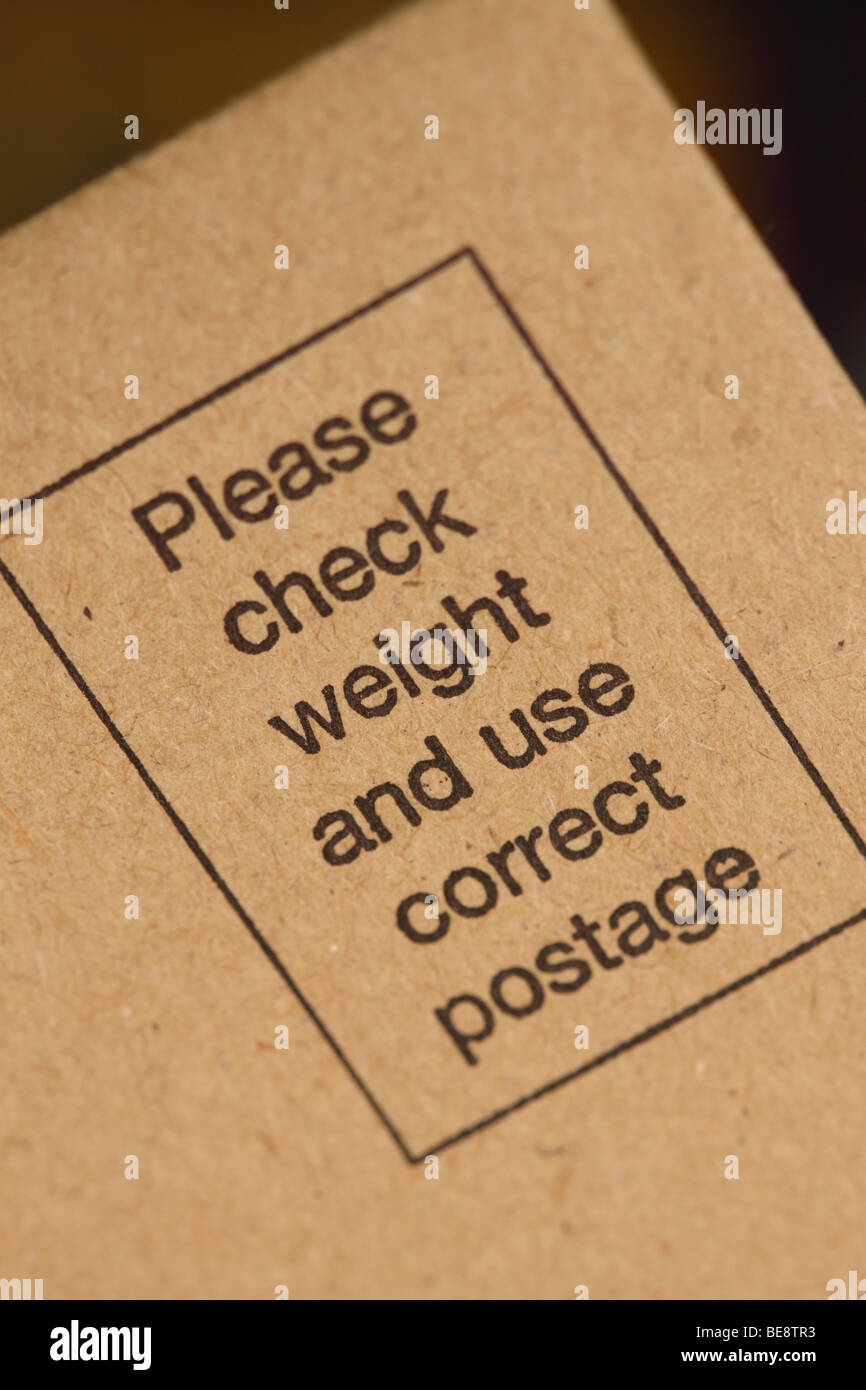 Postage envelope with reminder to check weight and apply correct postal stamp Stock Photo
