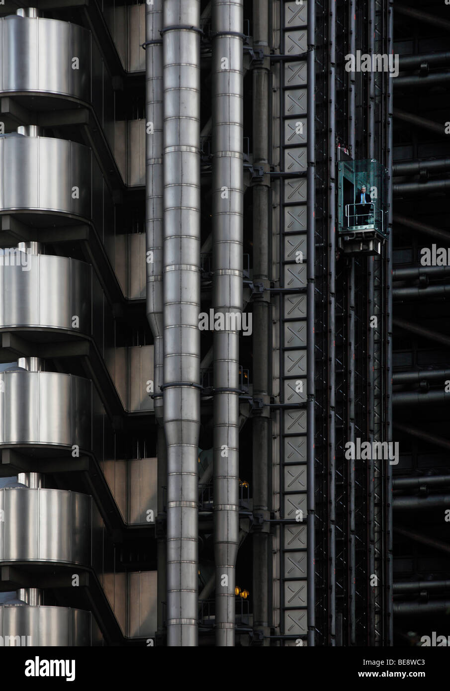Lloyds building with a man in an elevator, London, England, United Kingdom, Europe Stock Photo