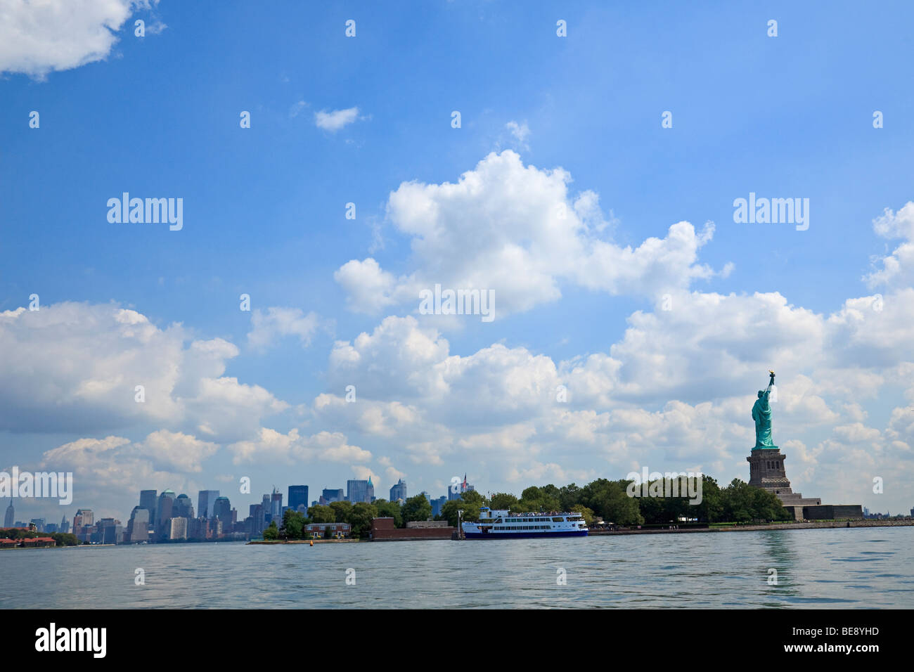 Statue of Liberty with New York City skyline behind. Stock Photo