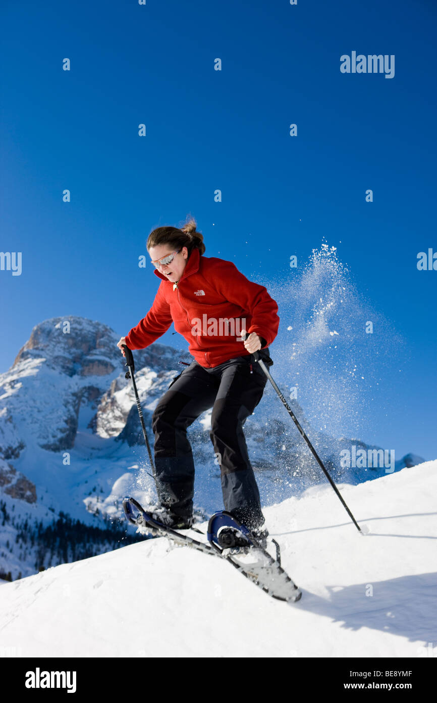 Woman snowshoeing, in the back the Hohe Gaisl mountain, Plaetzwiese