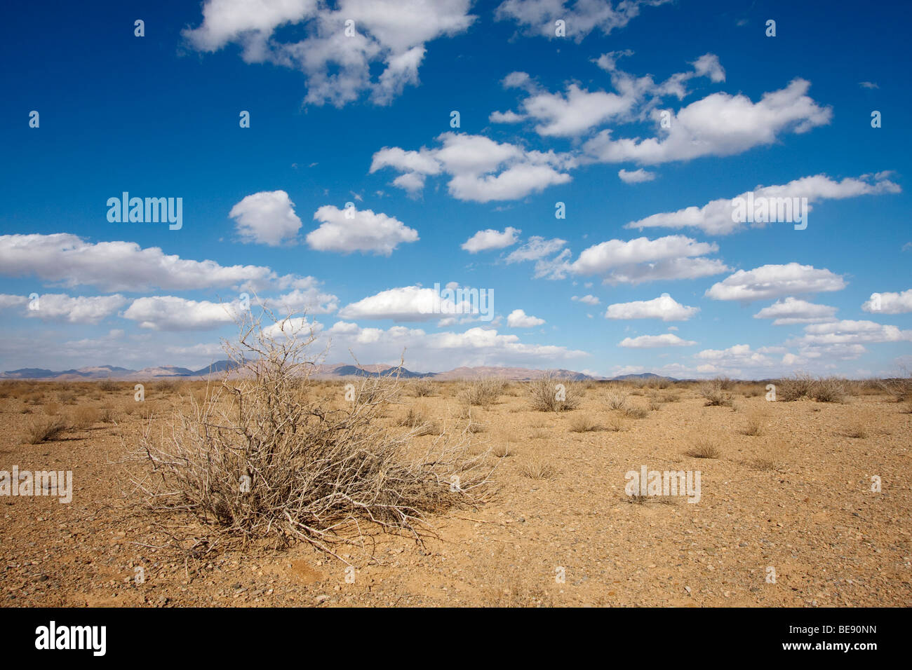Clouds without rain over the dry arid plains in central Iran Stock Photo