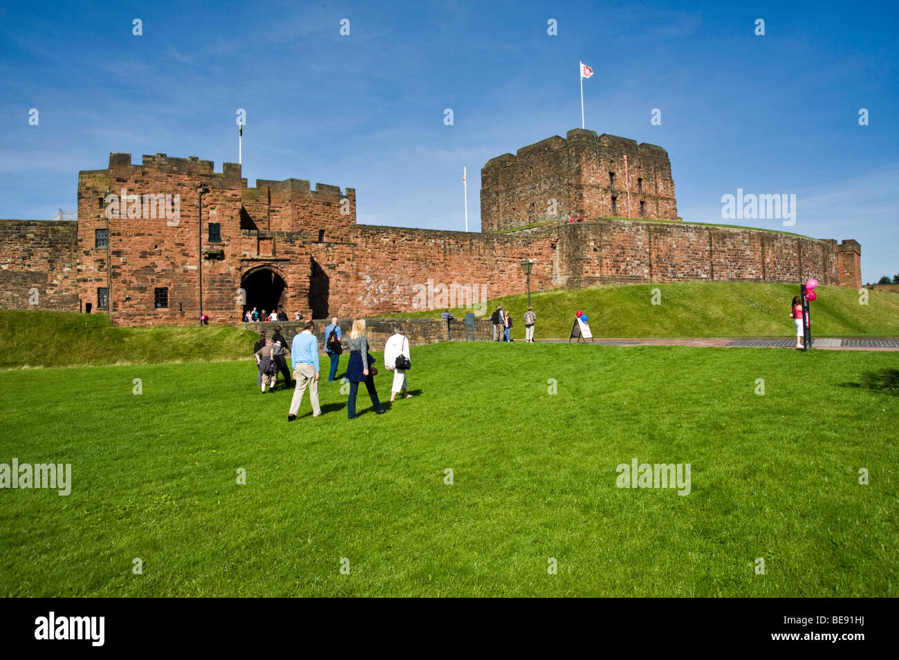 Tourists making their way to Carlisle Castle, Cumbria, England, UK Stock Photo