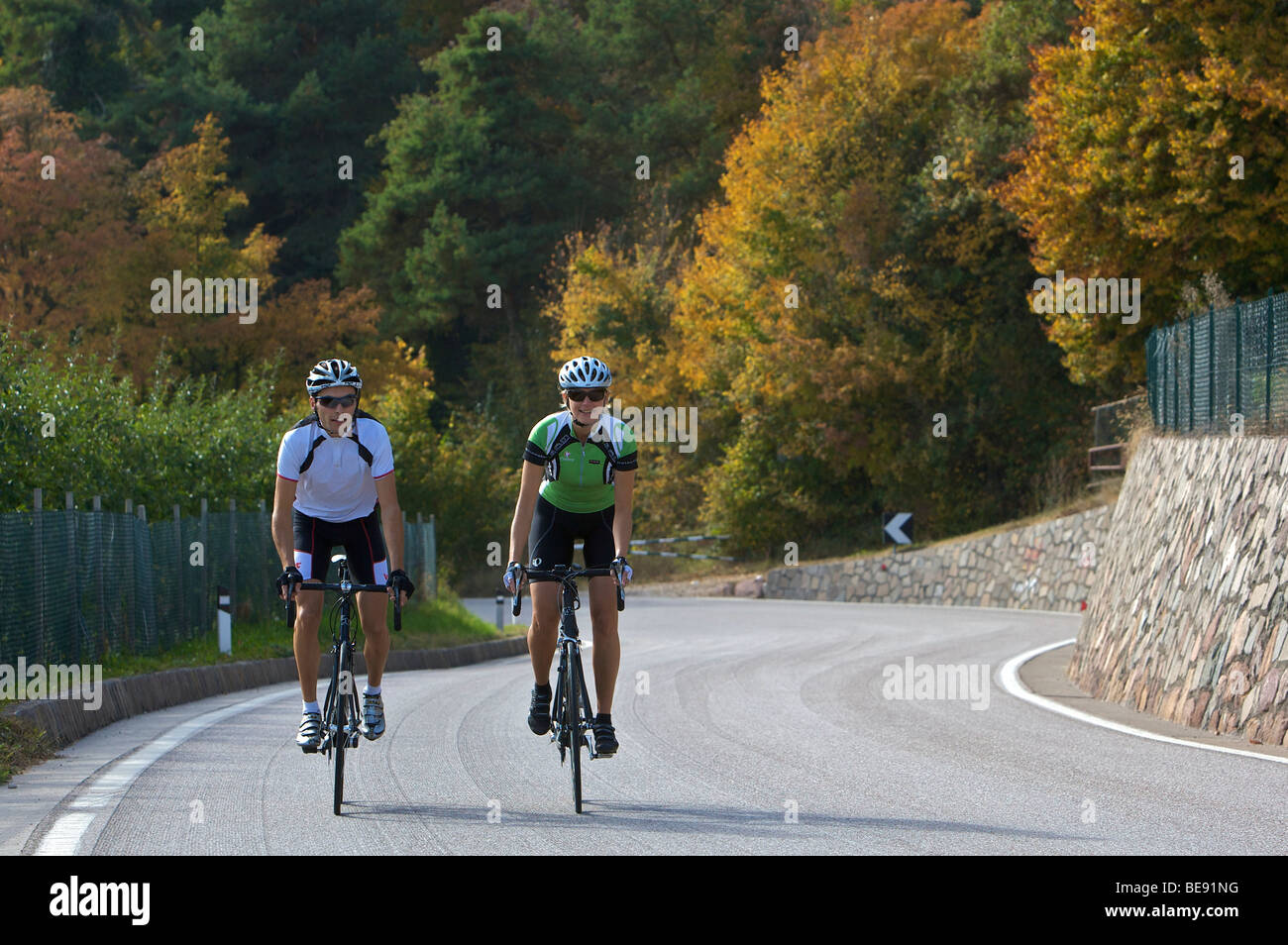 Bicycle racers at the Mendel Pass above Caldaro, South Tyrol, Italy ...