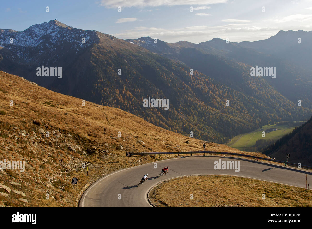 Bicycle racers at a bend in the Passo di Pennes road, South Tyrol, Italy, Europe Stock Photo