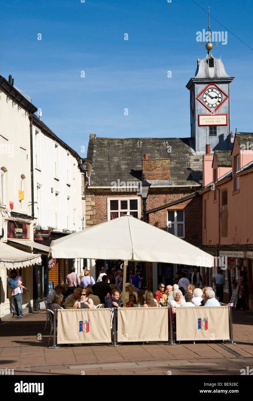 People sitting in pavement café in Carlisle City centre, Cumbria, uk Stock Photo