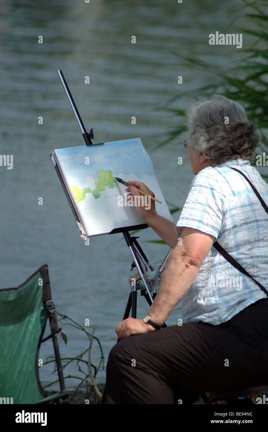 middle aged woman painting a watercolour, Christchurch, England, UK Stock Photo