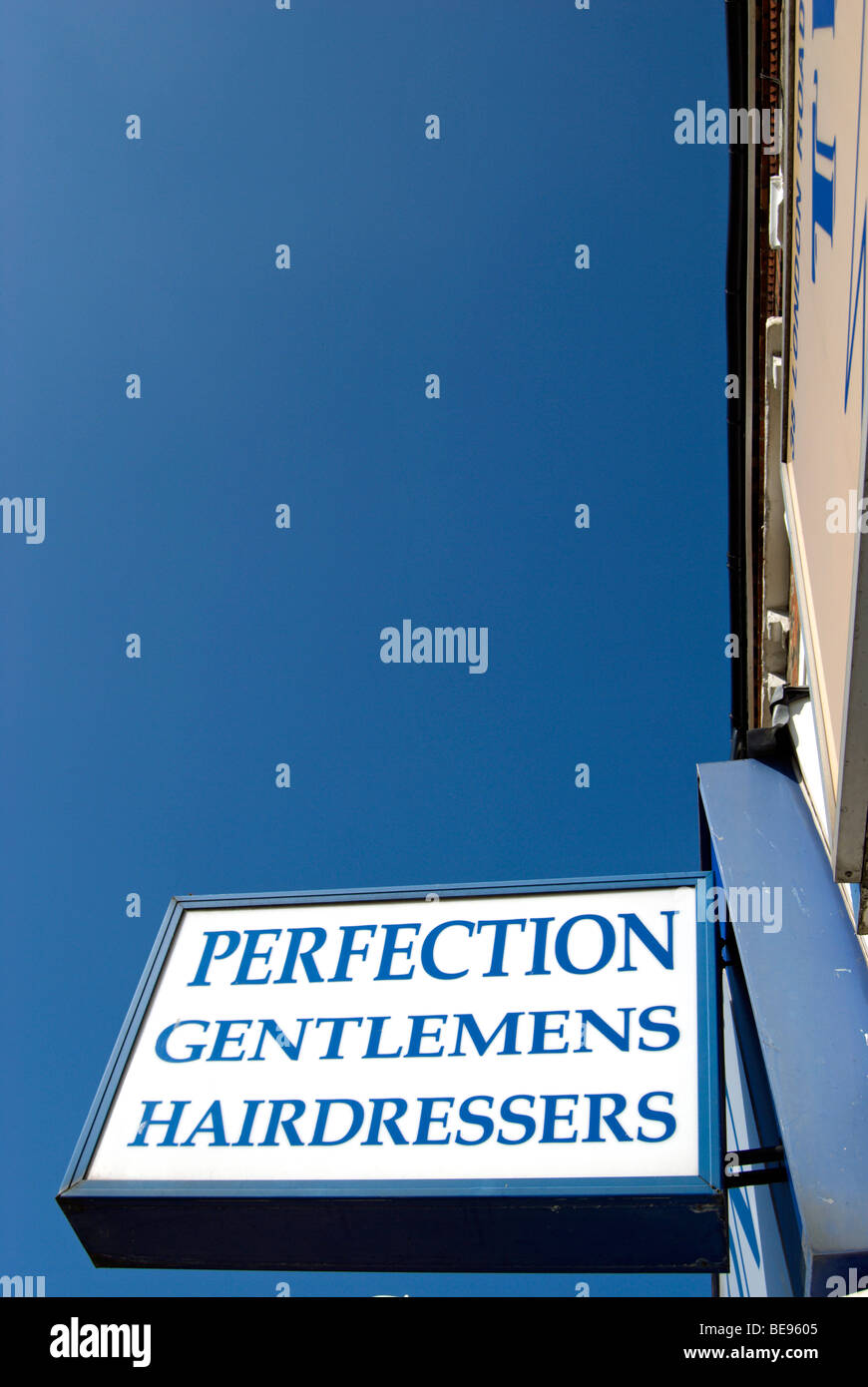 sign for perfection gentlemens hairdressers in twickenham, middlesex, england Stock Photo Alamy