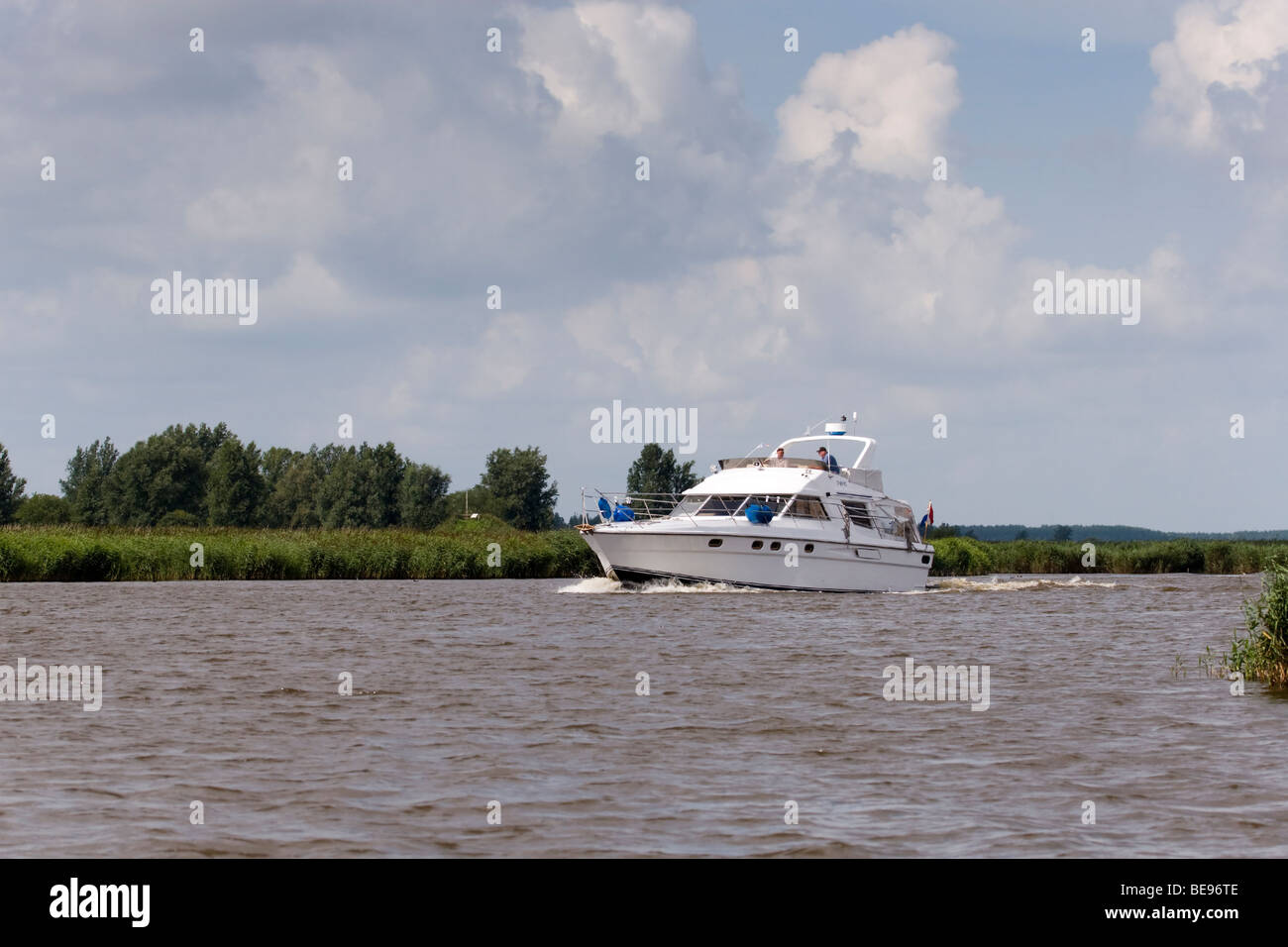 Yacht boat in Lauwersmeer National Park; Motorjacht in Nationaal Park Lauwersmeer Stock Photo