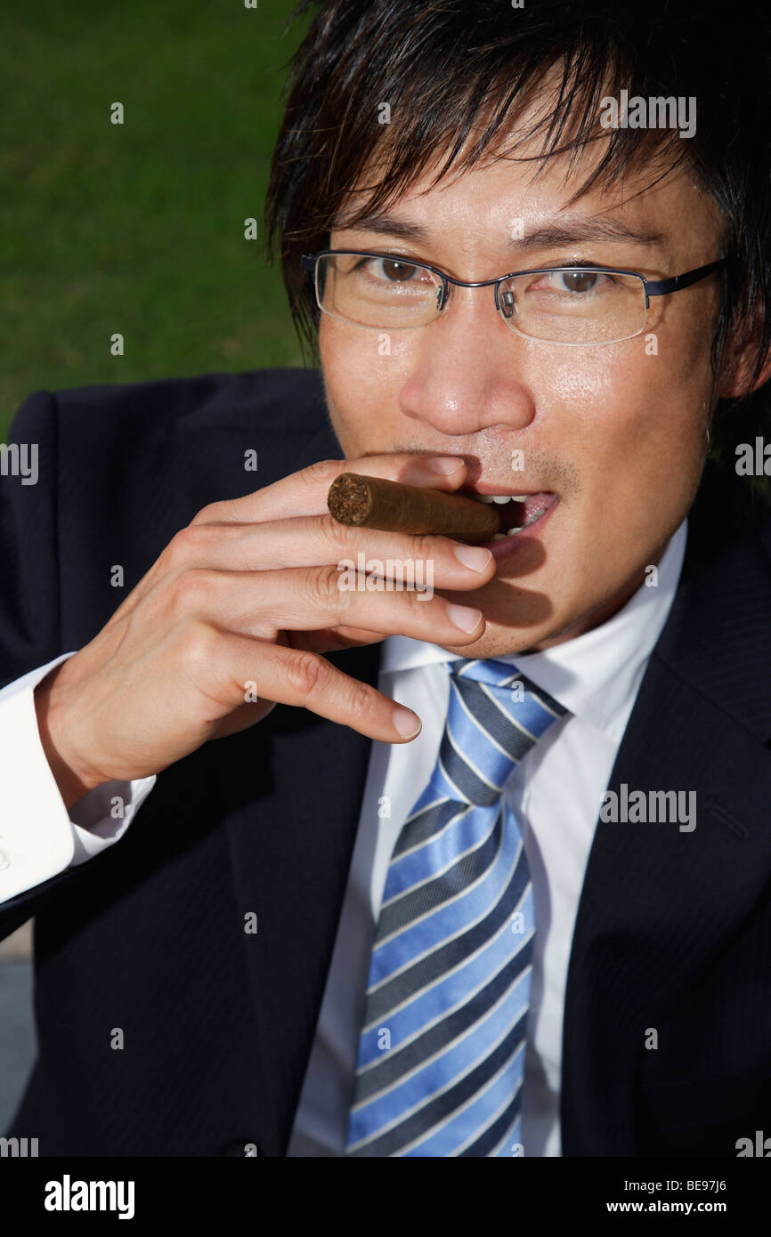 Businessmen with cigar Stock Photo