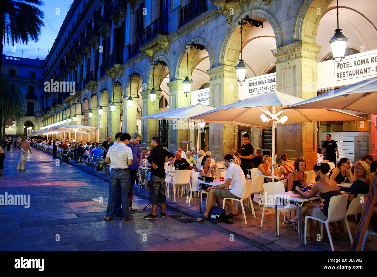 People dining alfresco on Plaza Reial. Barcelona. Spain Stock Photo