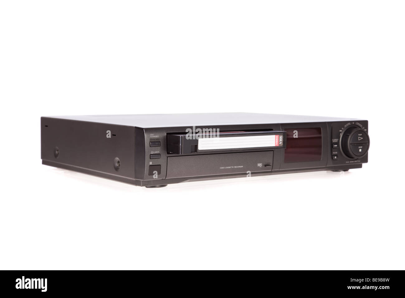 Old Video Cassette Recorder ejecting tape isolated on white background