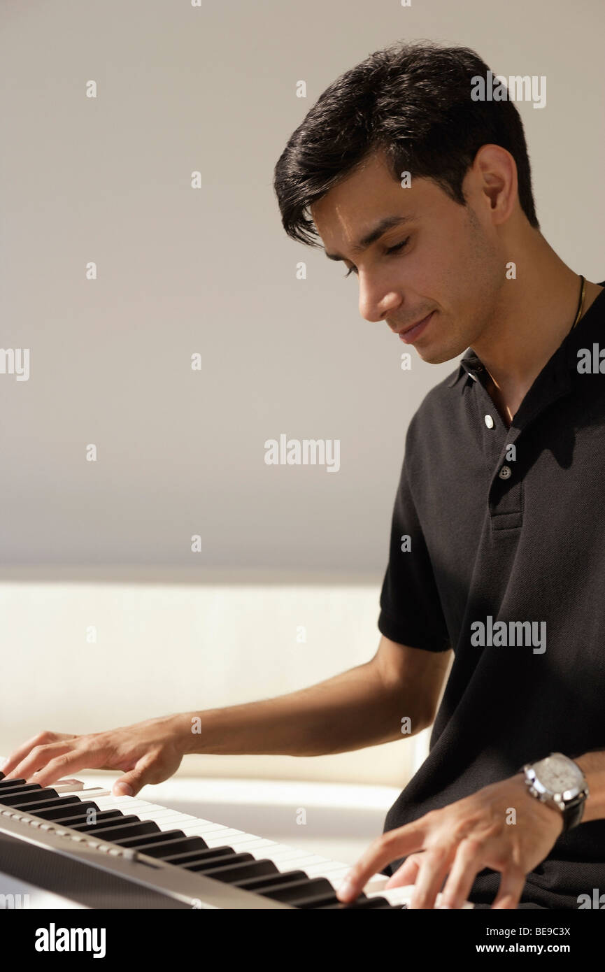 A man plays the piano Stock Photo Alamy