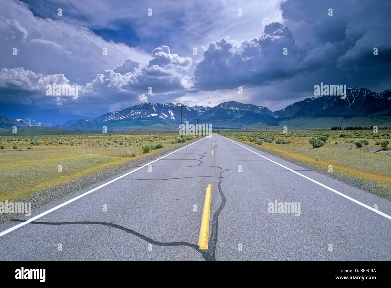 Highway 120 in Pumice Valley, summer thunderstorms form over east side of Sierra Nevada, near Lee Vining, California USA Stock Photo