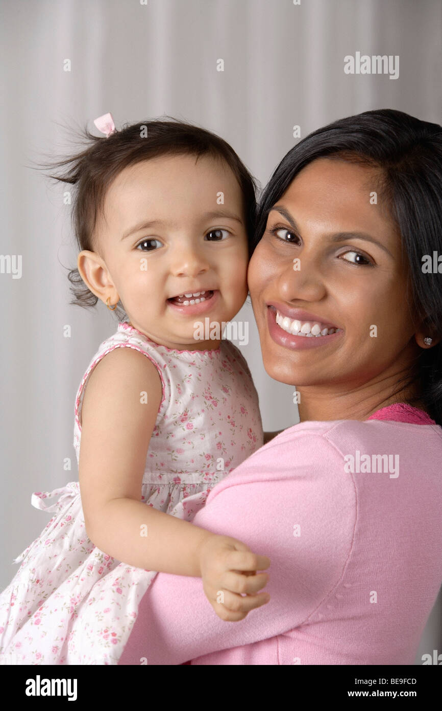woman carrying baby Stock Photo Alamy