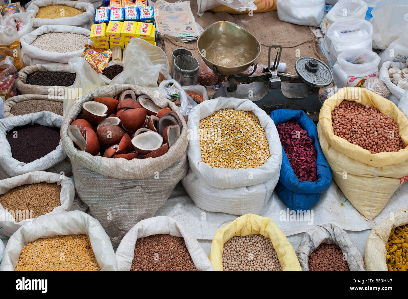 indian market stall with sacks of indian spices and dried produce Stock Photo