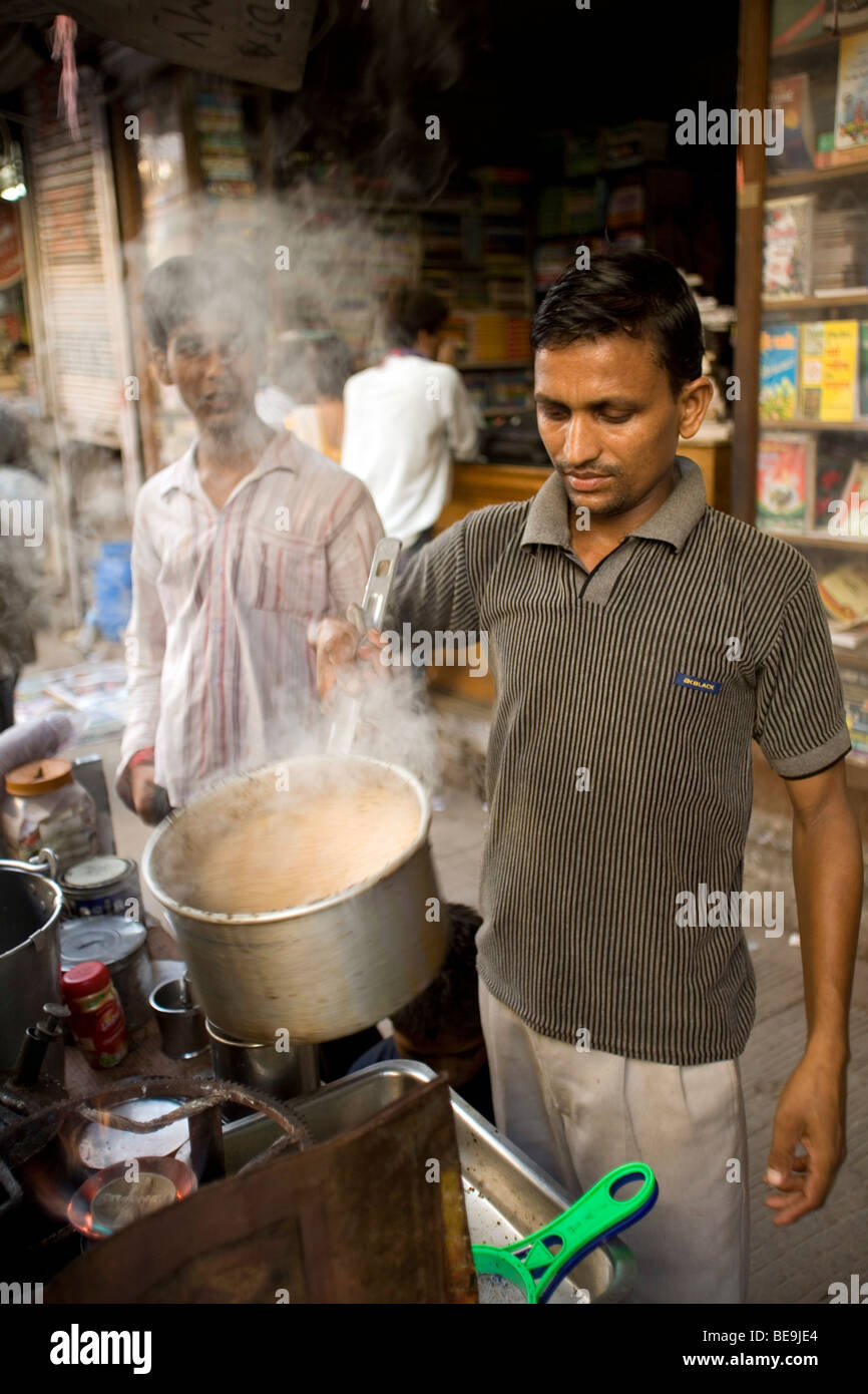 A Chai Wallah or tea maker makes tea in Old Delhi, India Stock Photo