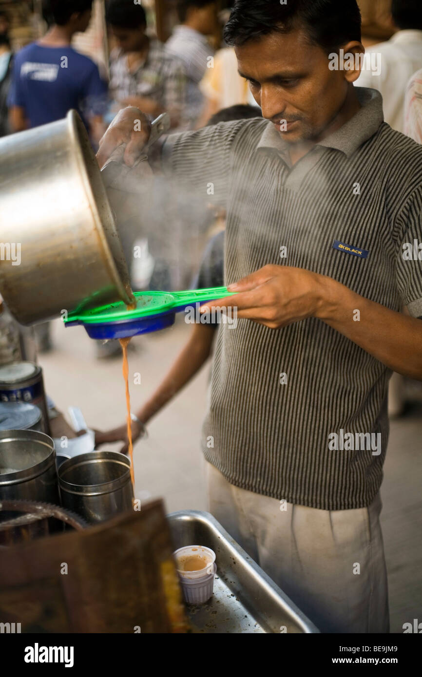 A Chai Wallah or tea maker makes tea in Old Delhi, India Stock Photo